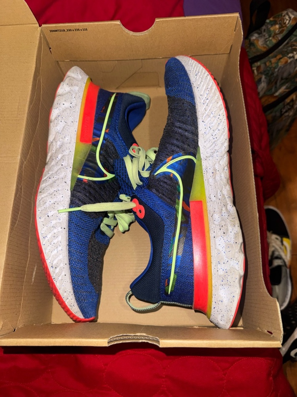 Nike men’s Blue Knit Sneakers with Neon Accents